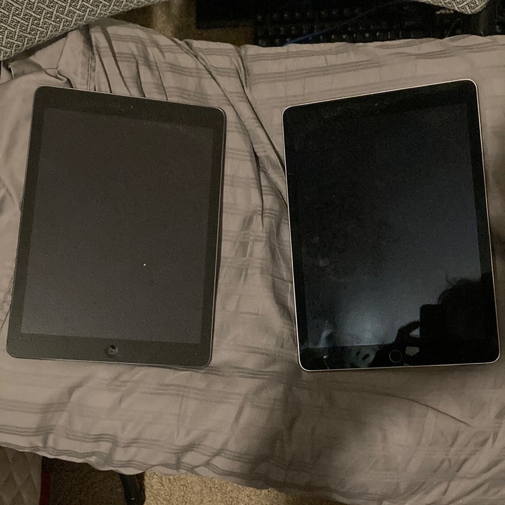 Charcoal grey newest iPad out and silver iPad one year older like new!!